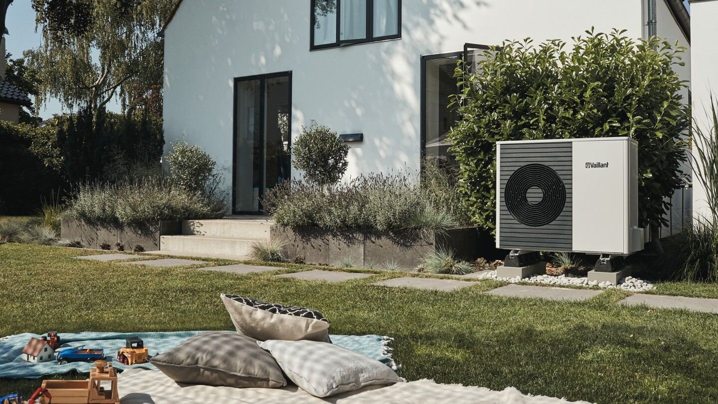 Air-to-water heat pump in the garden of a family home